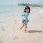 two-little-girls-playing-chase-beach-8595-13479