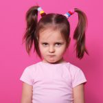 sad-little-girl-stands-pink-wall-cute-kid-wears-rose-t-shirt-has-two-fanny-poni-tails-with-many-colourful-scrunchies-looks-hurt-with-pouty-lips-upset-child-playground-176532-8710