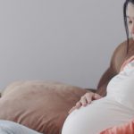 young-asian-pregnant-woman-holding-her-belly-talking-with-her-child-mom-feeling-happy-smiling-positive-peaceful-while-take-care-baby-pregnancy-lying-sofa-living-room-home-7861-2109
