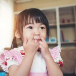 portrait-little-asian-girl-playing-her-home_1150-5014