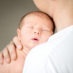 sleeping-newborn-male-shoulder_1163-1817