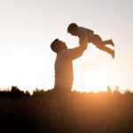 father-son-playing-park-sunset-time-happy-family-having-fun-outdoor_8353-8194